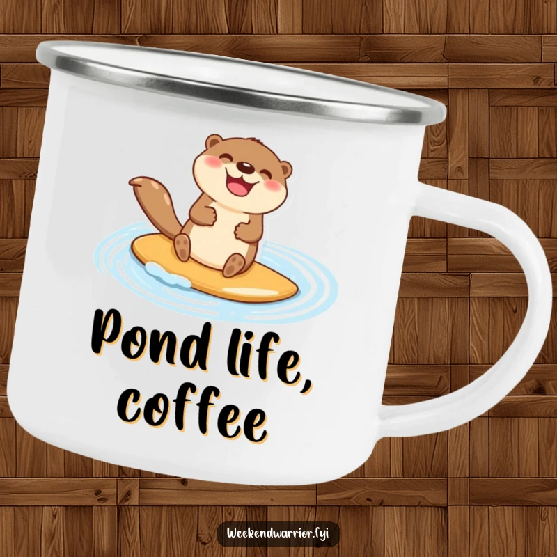 Funny camping mug with a happy otter character jubilantly paddleboarding across a shimmering blue pond, perfect for outdoor enjoyment.