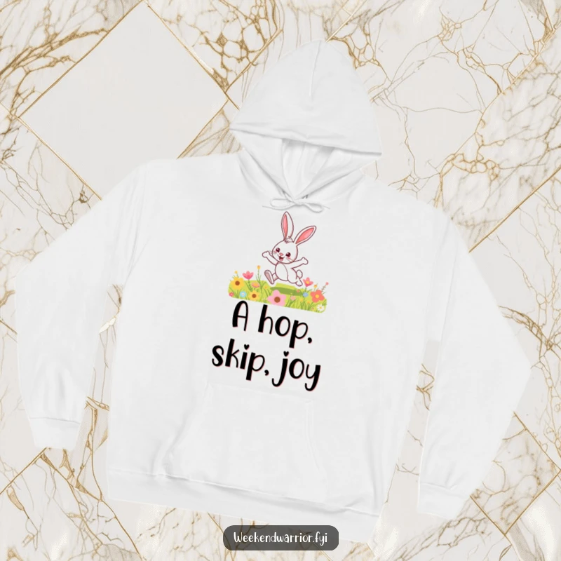 Funny hoodie showcasing a joyful cartoon bunny hopping through a colorful meadow, bringing cozy, spring-themed humor.