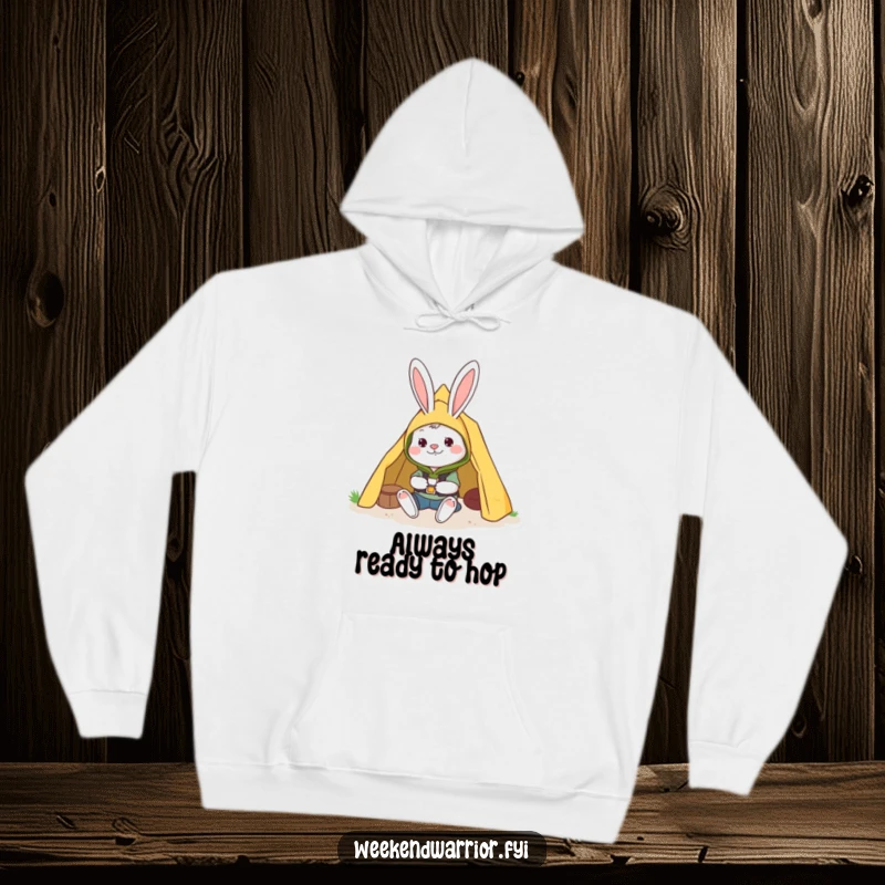 Funny hoodie featuring a cheerful rabbit in camping gear setting up a tent, ideal for camping and outdoor activities.