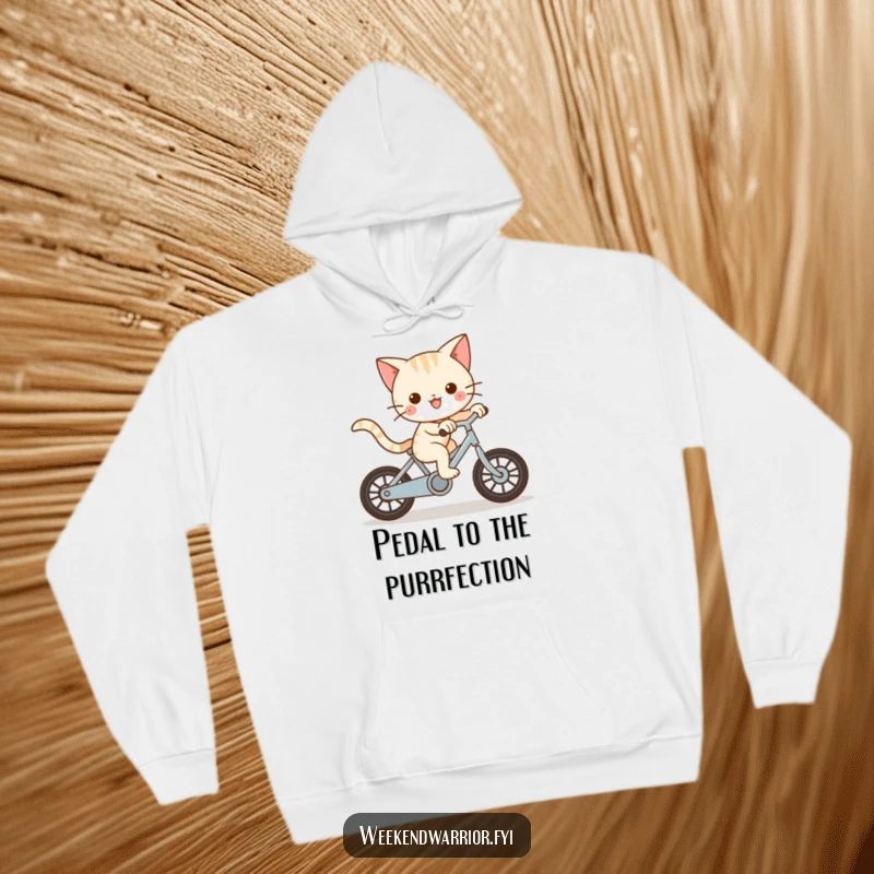 Funny Kawaii cat character joyfully riding a bike at great speed on a hoodie, capturing playful motion.