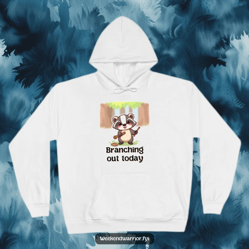 Funny hoodie with a happy badger wielding a small axe, chopping a twig, conveying a sense of forest adventure.