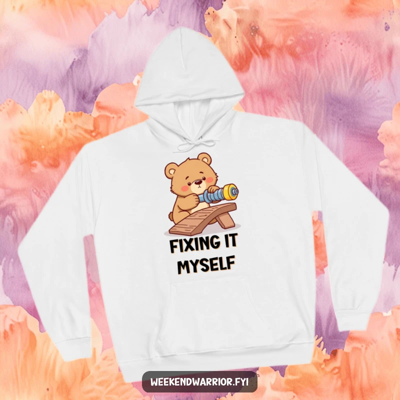 Funny hoodie displaying a determined bear intensely tightening a bolt on a makeshift ramp, exuding focus and effort.