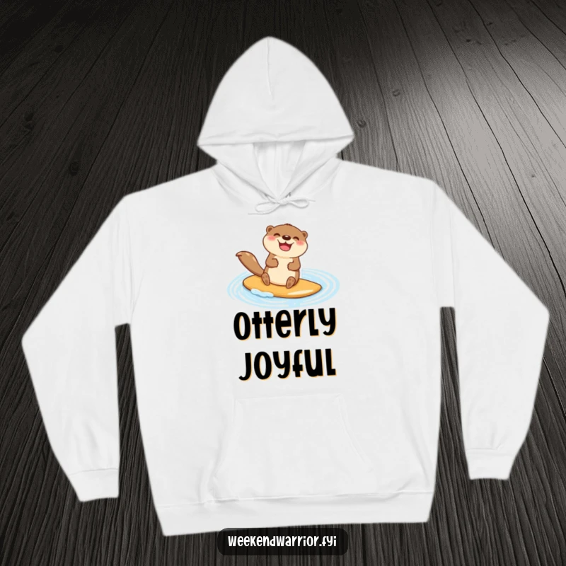 Funny hoodie with a happy otter character jubilantly paddleboarding across a shimmering blue pond, perfect for cozy relaxation.
