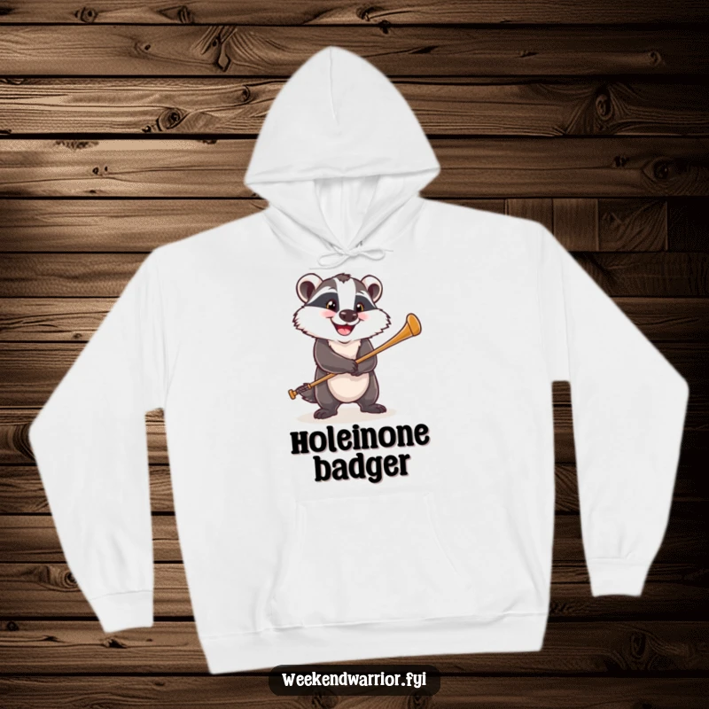 Funny hoodie featuring a happy badger with a determined grin, swinging a golf club with focus and sporty enthusiasm.