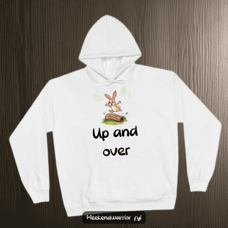 Funny hoodie featuring an energetic rabbit leaping over a log on a forest trail, perfect for outdoor enthusiasts.