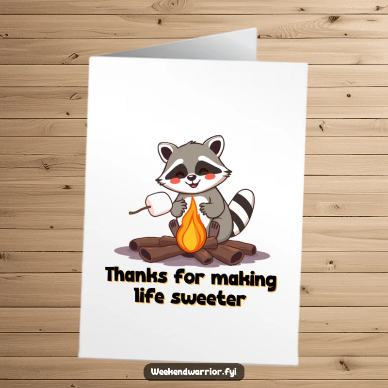 Funny Free Printable Thank You Card: Joyful raccoon roasting a marshmallow over a campfire, showing thanks with cozy humor, downloadable art.