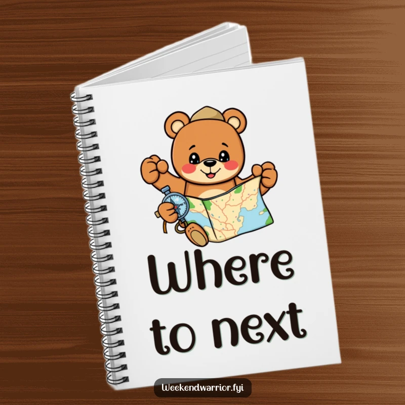 Funny, cheerful bear holding a map and compass on a notebook, for planning adventures.