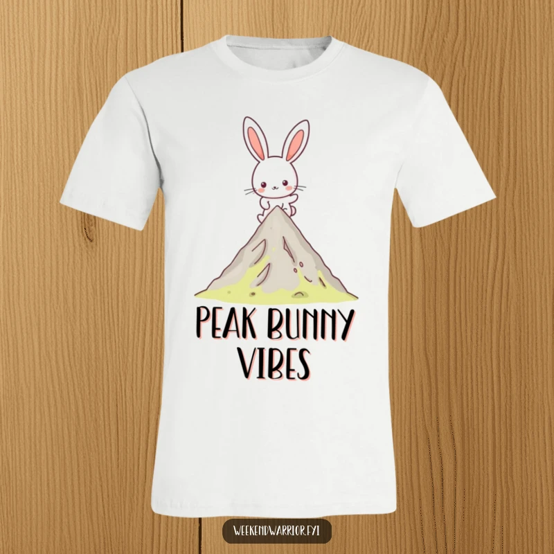 Funny Kawaii rabbit t-shirt showing a happy character determinedly hiking up a mountain peak, exuding joyful energy.